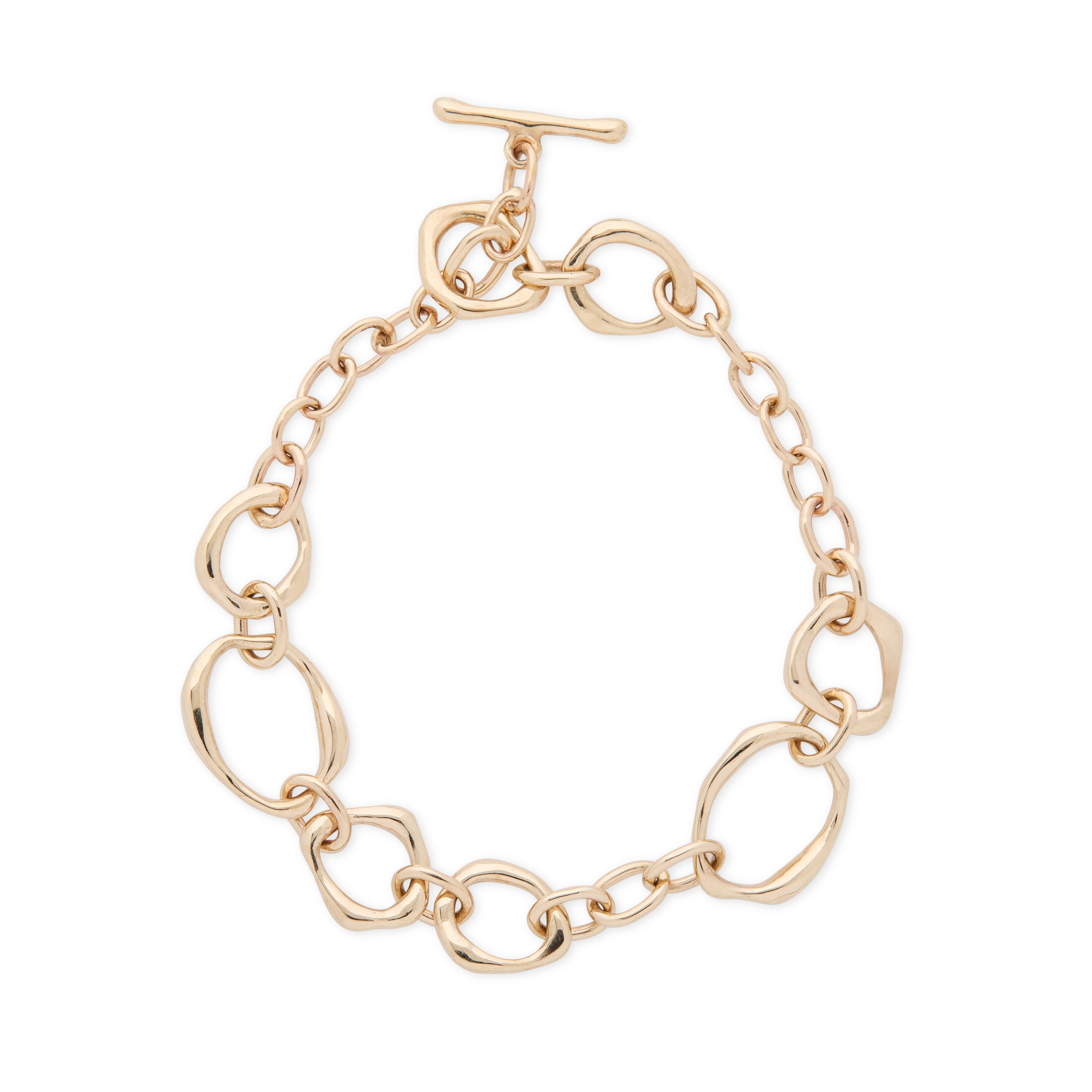 Gold handmade chain bracelet on a white background